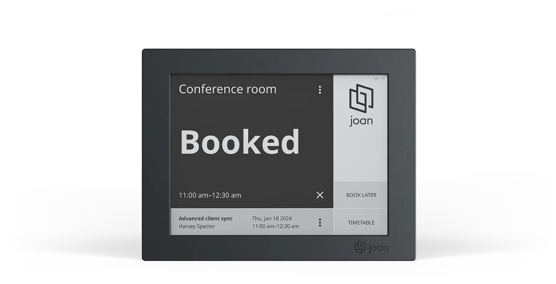 A Joan 6 RE room panel in a black frame showing a conference room as booked